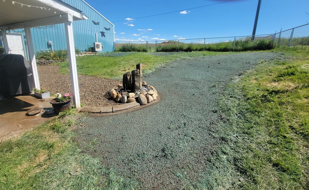 Freshly hydroseeded front yard with the MKB Lawn Care hydroseeder trailer