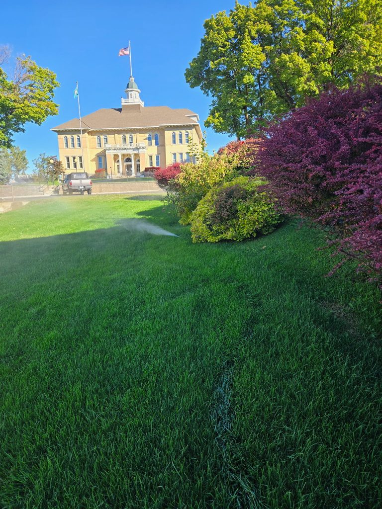 Sprinkler watering the front lawn of the Lincoln County Courthouse in Davenport, WA